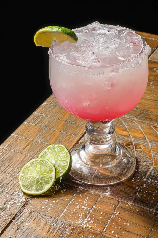 Signature craft cocktail with premium spirits and fresh garnish served at Wolfpack Woodfired Tavern in Sealy, Texas