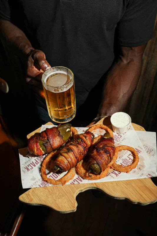 Texas Twinkies featuring bacon-wrapped jalapeños stuffed with smoked brisket and cream cheese at Wolfpack Woodfired Tavern in Sealy, Texas